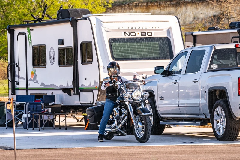 biker and RV at our Medina River RV park